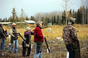 Photo courtesy Steve Meyer A team of five participate in a round of clay pigeon shooting at the Shoot for the Cure fundraiser event Saturday, Oct. 4, 2014 at the Snowshoe Gun Club in Kenai. The event, which began eight years ago in Anchorage to raise awareness for Cystic Fibrosis, was held on the Kenai Peninsula for the first time this year.