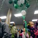 Photo by Rashah McChesney/Peninsula Clarion  Cora O'Connor, 6, collects ballloons during Kenai Peninsula Borough Mayor candidate Mike Navarre's election night party on Tuesday October 7, 2014 in Soldotna, Alaska.