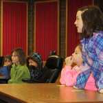 Photo by Dan Balmer/Peninsula Clarion Students from Joy Harper's third and fourth grade class from Kaleidoscope School of Arts and Science hold a mock trial on a story about bullying in the old Kenai courthouse Monday, Oct. 6, 2014. Three classes took part in a field trip to Kenai City Hall to learn about how governement works.