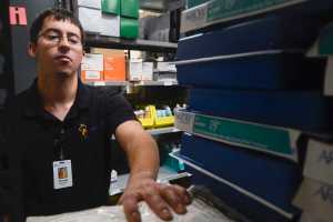 Photo by Rashah Mcchesney/Peninsula Clarion  Forrest Henry walks through gives a tour of a supply room at Thursday October 9, 2014, where he works as an intern through the Project SEARCH program at Central Peninsula Hospital in Soldotna, Alaska.