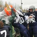 SoHi defensive coordinator Eric Pomerlau is doused by happy Stars players, from left, Ty Fenont (7), Jared Chavez (8), Brenner Furlong (40) and Dalton Best (66).