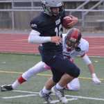 SoHi's Jace Urban scores on a pass play, beating Juneau's Manase Maake.  Photo by Michael Dinneen for the Clarion.