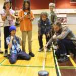 Photo by Kelly Sullivan/ Peninsula Clarion Members of the Fireweek Academy's Mind Amazes team, the District 12 los locos, react with excitement as Quinn Stoops, a substitue teacher in the Kenai Peninsula Borough School District, successfully tests the strength of the team's "rope" in the "spontaneous problem" portion of the competition Saturday, October 11, 2014, at Soldotna Prep School in Soldotna, Alaska.