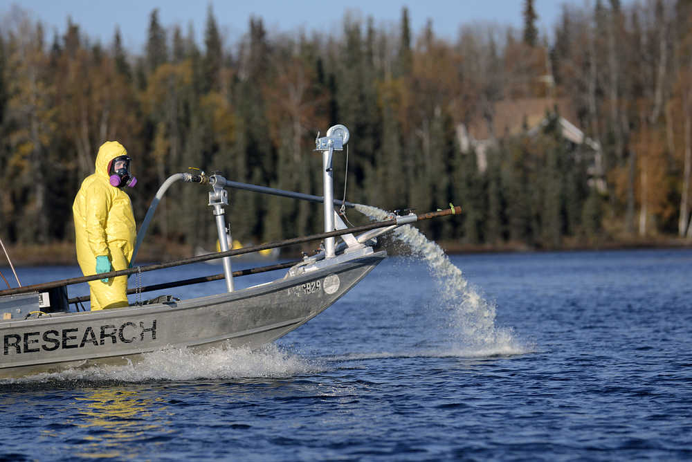 Photo by Rashah McChesney/Peninsula Clarion An interagency team worked with the Alaska Department of Fish and Game to apply the fish-killing poison rotenone to East Mackey Lake Wednesday October 8, 2014 in Soldotna, Alaska. The lake was one of four treated as part of a four-year project aiming to eradicate invasive northern pike from the Soldotna Creek drainage.