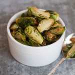 This Sept. 22, 2014 photo shows fried Brussels sprouts in Concord, N.H. Chic menus at restaurants around the country have begun serving Brussels sprouts after kale introduced Americans to the idea that there actually are many ways to prepare most vegetables. (AP Photo/Matthew Mead)