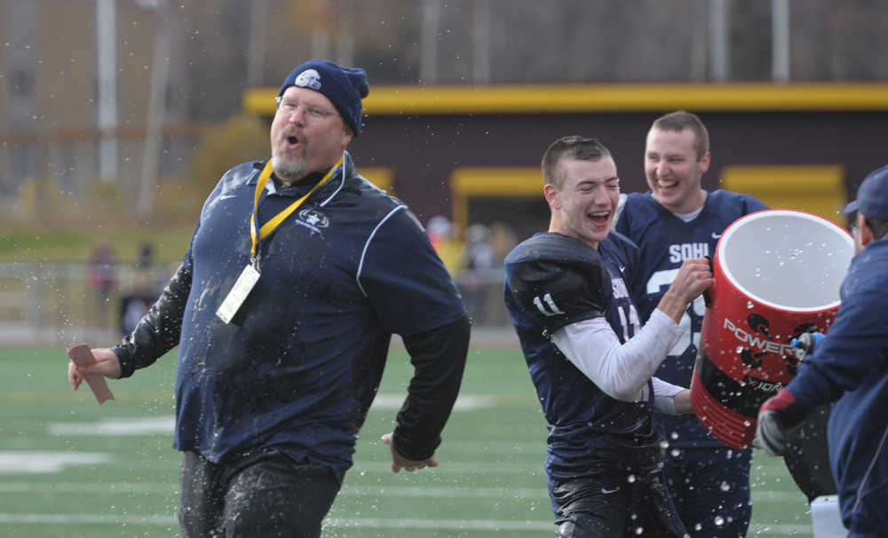 SoHi head coach Galen Brantley Jr. is doused by Brooks Furlong (11) as the game winds down.  Photo for the Clarion by Michael Dinneen