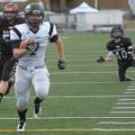 Nikiski's Chrisitan Riddall runs for the Bulldog's first touchdown.  Photo for the Clarion by Michael Dinneen
