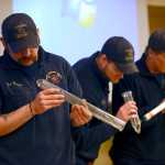Photo by Rashah McChesney/Peninsula Clarion Central Emergency Services firefighters Josh Thompson, Matt Seizys and Jason Cooper look at paraphernalia used for making hash oil, a cannabis derivative, after a presentation from a fire investigator from Aurora, Colorado on Wednesday October 22, 2014 in Soldotna, Alaska.
