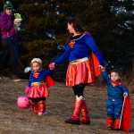 Photo by Rashah McChesney/Peninsula Clarion  Tatum O'Brien, 3, runs from her mother during the Tsalteshi Trails Association's Spook Night Trick-or-Treat Trail and Fun Run Sunday October 26, 2014 in Soldotna, Alaska.