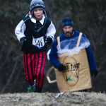 Photo by Rashah McChesney/Peninsula Clarion  (left) Penelope Priest, 3, Marie Priest and North Priest, 3, walk down a hill at the Tsalteshi Trails after trick-or-treating during the Tsalteshi Trails Association's Spook Night on Sunday October 26, 2014 in Soldotna, Alaska.