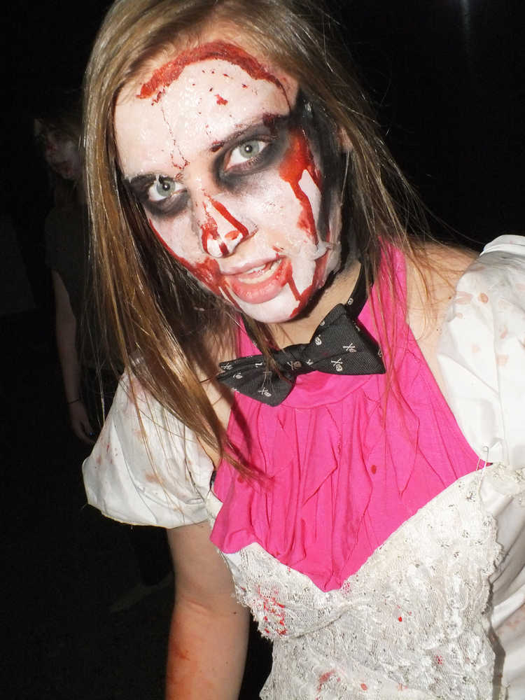 Photo by Ben Boettger/Peninsula Clarion Soldotna High School junior Amber Hall as a zombie at the haunted house fundraiser, Tuesday Oct 28, 2014 at the Peninsula Center Mall.