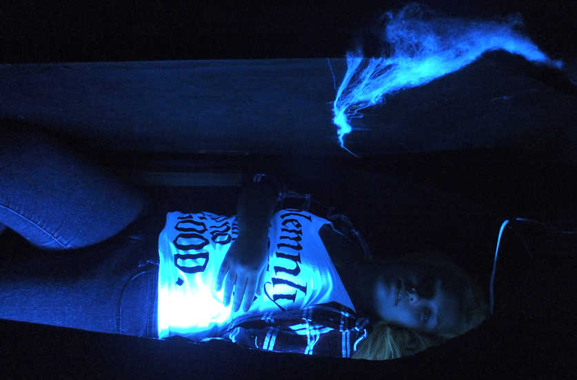 Ben Boettger/Peninsula Clarion Senior Paige Reide emerges from a coffin at the Soldotna High School drama club's haunted house fundraiser on Tuesday, October 28, at Peninsula Center Mall.