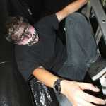 Ben Boettger/Peninsula Clarion Nathan Heathers menaces visitors from the top of a ladder at the Soldotna High School Drama Troupe's haunted house fundraiser on Tuesday, October 28, 2014, at the Peninsula Center Mall.