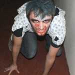 Ben Boettger/Peninsula Clarion Senior Zach Haslow plays a murderous psychopath at the Soldotna High School Drama Troupe's haunted house fundraiser on Tuesday, October 28, 2014 at the Peninsula Center Mall.