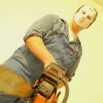 Ben Boettger/Peninsula Clarion Stockton Jones plays a chainsaw killer at the Soldotna High School Drama Troupe's haunted house fundraiser, Tuesday October 28, 2014, at the Peninsula Center Mall