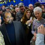 Photo by Rashah McChesney/Peninsula Clarion  Sen. Ted Cruz, R-Texas, poses for a photograph with an audience member after a stump speech for Alaska Senate Candidate Dan Sullivan on Sunday Nov. 2, 2014 in Soldotna, Alaska.