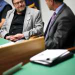 Photo by Rashah McChesney/Peninsula Clarion Eric Treider, candidate for State Senate District O, looks at incumbent Peter Micciche as the two discuss their political experience during a Central Kenai Peninsula League of Women Voters debate on Thursday Oct. 30, 2014 in Soldotna, Alaska.
