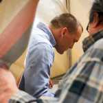 Photo by Rashah McChesney/Peninsula Clarion Sophia Micciche looks at her dad, incumbent state Sen. Peter Micciche, R-Soldotna, while Stella Micciche looks on at the polling place in Soldotna City Hall on Nov. 4, 2014 in Soldotna, Alaska.