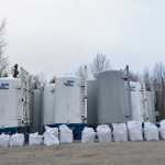 Photo by Rashah McChesney/Peninsula Clarion A workers clears the airway of a large vaccuum tube being used to remove a cement material from the woods at a Baker Hughes facility, on Wednesday November 5, 2014 in Nikiski, Alaska.