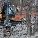Photo by Rashah McChesney/Peninsula Clarion Several air quality moniters hang in trees near  a Baker Hughes facility where workers are cleaning up several thousand pounds of a cement dust mixture, on Wednesday November 5, 2014 in Nikiski, Alaska.