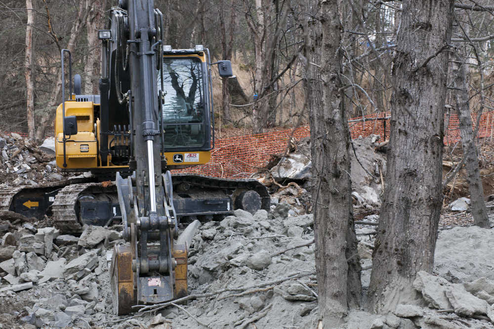 Photo by Rashah McChesney/Peninsula Clarion Several air quality moniters hang in trees near  a Baker Hughes facility where workers are cleaning up several thousand pounds of a cement dust mixture, on Wednesday November 5, 2014 in Nikiski, Alaska.