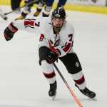 Photo by Rashah McChesney/Peninsula Clarion Kenai Central High School Kardinal Tyler Lingafelt chases the puck down during a game against the Homer High School Mariners on Friday Nov. 7, 2014 in Soldotna, Alaska.