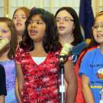 Photo by Dan Balmer/Peninsula Clarion Students with the Mountain View Elementary School Choir sing patriotic songs Monday, Nov. 10, 2014 at the Kenai Senior Center. The concert was part of a evening of festivities to celebrate and remember veterans.