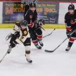 Photo by Kelly Sullivan/ Peninsula Clarion Kenai Brown Bears' Alex Jackstadt races away from Minnesota Magicians' with control of the puck Friday, November 14, 2014 at the Soldotna Regional Sportd Complex in Soldotna, Alaska.