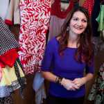 Photo by Rashah McChesney/Peninsula Clarion  Katrina Carpenter stands among several handmade dresses in the sewing room of her home, where she runs the business Kat's Closet in Nikiski, Alaska. Carpenter often mends clothing, sews on patches and buttons and alters pieces for customers - but she finds herself drawn to designing and creating dresses, she said.