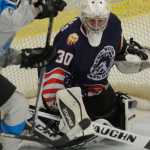 Photo by Kelly Sullivan/ Peninsula Clarion Kenai River Brown Bears' number 30, Alec Derks, blocks a shot by Wenatchee Wild's number 20, Shane Bennett, Friday, Nov. 21, 2014 at the Soldotna Regional Sports Complex in Soldotna, Alaska.