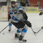Photo by Kelly Sullivan/ Peninsula Clarion Kenai River Brown Bears' number 24, Joseph Kaszupski, races to take the puck from Wenatchee Wild's number 19, Mike Coyne, Friday, Nov. 21, 2014 at the Soldotna Regional Sports Complex in Soldotna, Alaska. Mitch Demario 21 Wenatchee Wild,  Joseph Kaszupski 24, Sam Carlson 11