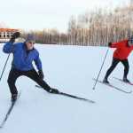 ADVANCE FOR WEEKEND EDITIONS, NOV. 29-30 - In this photo taken on Nov. 17, 2014, Nordic ski instructor Tim Buckley, left, stresses the importance of stretching as he works with beginning classic cross country skiing students from the Osher Lifelong Learning Institute at UAF during their class at Birch Hill Recreation Area in Fairbanks, Alaska.  Buckley, 70, is a lifelong skier and has been teaching both classic and skate techniques to children and adults for 15 years. Buckley is the Spotlight for the week.  (AP Photo/Fairbanks Daily News, Miner, Eric Engman)