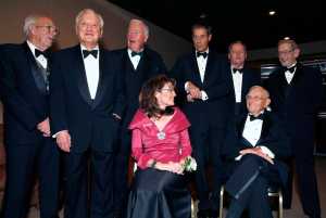 FILE - In this Nov. 14, 2008, file photo, former Alaska governors Bill Sheffield, left, Walter J. Hickel, Frank Murkowski, Tony Knowles, Steve Cowper, and Keith Miller, right, with then Gov. Sarah Palin, front left, and Territorial Gov. Mike Stepovich, front right, talk as they wait for a ceremony to honor Alaska governors as part of Alaska's 50th anniversary in Anchorage, Alaska. Bill Walker became the 13th governor of Alaska this week. Or its 11th governor. Or 16th or 17th. It depends on how you count. As it turns out, the state of Alaska doesn't appear to have an official way of counting governors and their terms. (AP Photo/Al Grillo, File)