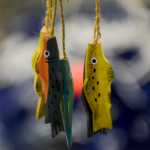 Photo by Rashah McChesney/Peninsula Clarion  Clay fish dangle from a wind chime at the Kenai Potters Guild sale Saturday Dec. 6, 2014 in Kenai, Alaska. The Guild holds intermittent sales and will hold another one on Mother's Day.
