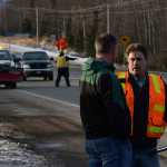 Photo by Rashah McChesney/Peninsula Clarion  Don Fritz, environmental program specialist with the Alaska Department of Environmental Conservation, photographs a pile of drilling mud that was spilled on the Kenai Spur Highway on Tuesday Dec. 9, 2014 in Nikiski, Alaska.