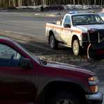 Photo by Rashah McChesney/Peninsula Clarion  Brian Gabriel, Department of Transportation Station Manager, works to scrape spilled drilling mud from a portion of the Kenai Spur Highway on Tuesday Dec. 9, 2014 near Mile 26 and Halliburton Road in Nikiski, Alaska.