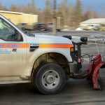 Photo by Rashah McChesney/Peninsula Clarion  AIMM Monofill Inc., representative Scott Anderson discusses a drilling mud spill with Brian Gabriel, Alaska Department of Transportation station manager, on Tuesday Dec. 9, 2014 in Nikiski, Alaska. The mud was spilled from a truck delivering mud to the monofill.