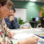 Photo by Rashah McChesney/Peninsula Clarion  English as a Second Language instructor Kathy Christopherson adds to a list of homophones during a class on Thursday Dec. 11, 2014 at Kenai Peninsula College Kenai River Campus in Soldotna, Alaska.