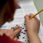 Photo by Rashah McChesney/Peninsula Clarion Kathy Christopherson, an English as a Second Language instructor at Kenai Peninsula College Kenai River Campus, reads through a newspaper article on the Affordable Care Act tailored for ESL students during a class on Thursday Dec. 11, 2014 in Soldotna, Alaska.