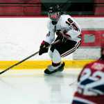 Photo by Rashah McChesney/Peninsula Clarion Kenai Central High School's  Dalton Dosko looks for an opening during a game against Anchorage's East High School on Friday Dec. 12, 2014 at the Soldotna Sports Complex in Soldotna, Alaska.