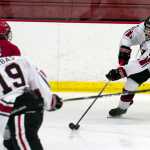 Photo by Rashah McChesney/Peninsula Clarion  Kenai Central High school's Riley Weber tries to find a way around an opponent during a game against Anchorage's East High School on Friday July 12, 2014 in Soldotna, Alaska.