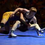 Photo by Joey Klecka/Peninsula Clarion Nikiski's Tyler Handley holds off an attack from Kotzebue's Spencer Woods in the 152-pound final at the Class 1-2-3A state wrestling championships, Saturday at Bartlett High School