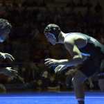 Photo by Joey Klecka/Peninsula Clarion  Nikiski junior Nathan Carstens sizes up Ketchikan's T. McBurnette in the 160-pound final at the Class 1-2-3A state wrestling championships, Saturday Dec. 13, 2014 at Bartlett High School in Anchorage, Alaska.