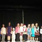 By IAN FOLEY/Peninsula Clarion The cast of A Charlie Brown Christmas sing on stage on December 12, 2014 in Kenai.