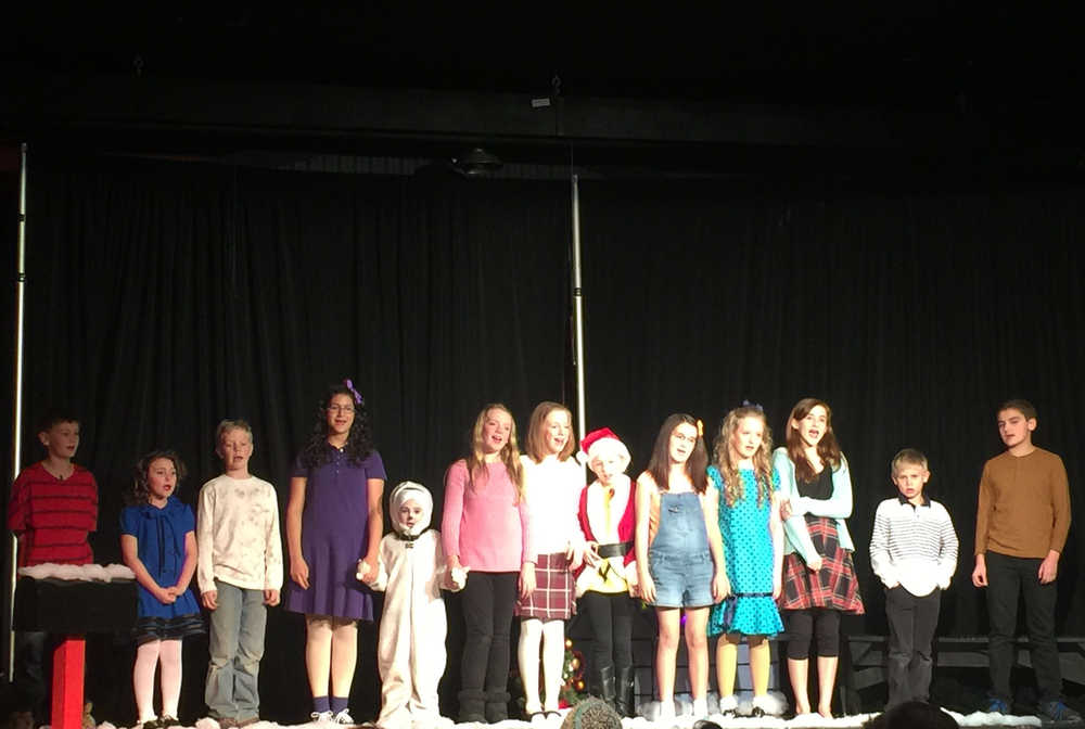By IAN FOLEY/Peninsula Clarion The cast of A Charlie Brown Christmas sing on stage on December 12, 2014 in Kenai.