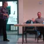 Photo by Dan Balmer/Peninsula Clarion Nikiski resident Larry Shafer asked a question while Kenai lawyer Marc Theiler responds at the Kenai Community Coalition on Cannabis town hall meeting Tuesday, Dec. 16, 2014 at the Challenger Learning Center in Kenai. Shafer, who said he voted against Ballot Measure 2, expressed an interest in being part of the coalition board, started by Theiler and defense attorney Eric Derleth, that would evaluate how responsible cannabis business practices could be developed in the community once lawmakers establish regulations.