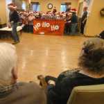 Photo by Kelly Sullivan/ Peninsula Clarion Mountain View Elementary second-graders sang Christmas carols at the Kenai Municipal Airport, Homer Electric Association, Inc., Charis Place Assisted Living and Walmart Wednesday, Dec. 17, 2014 in Kenai, Alaska.