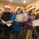 Photo by Kelly Sullivan/ Peninsula Clarion Students from Mountain View Elementary School sing "All I want for Christmas is my two front teeth," to an attentive audience at Charis Place Assisted Living Wednesday, Dec. 17, 2014 in Kenai, Alaska.