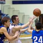 20 looks for an opening during a gameagainst Palmer High School on Friday Dec. 19, 2014 at Soldotna High School in Soldotna, Alaska.