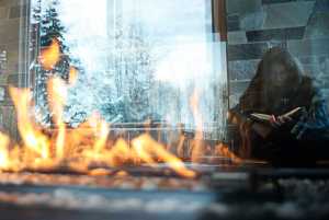 Photo by Rashah McChesney/Peninsula Clarion  In this Jan. 2, 2014  Maura Johnson, 19, reads the fantasy book "Shadows" by Robin McKinley at the newly revamped public library in Soldotna, Alaska.